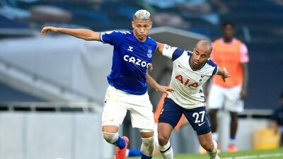 Everton's Richarlison, left, under pressure from Lucas Moura of Spurs. PA
