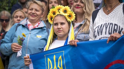 People gather for a Ukraine solidarity rally at Calton Hill in Edinburgh, Scotland. PA