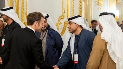 The UAE's ambassador to France, Fahad Al Raqbani, meets Mr Macron. Ryan Carter / UAE Presidential Court