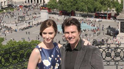 Emily Blunt, in a floral sleeveless midi, and Tom Cruise attend a photocall for 'Edge Of Tomorrow' at The Trafalgar Hotel on May 25, 2014 in London, England. Getty Images