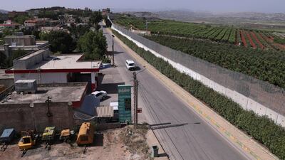 A car drives along the village of Kfar Kila on the Lebanese-Israeli border in southeast Lebanon. AP Photo