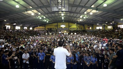 Rodrigo Duterte, known for his bare-knuckle stance on crime, lays out his presidential platform to college students during a campaign stop north of Manila. Noel Celis / AFP