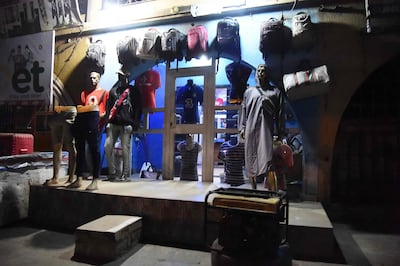 A boutique is powered by a generator to supply electricity as Nigeria struggles to keep lights on as power shortages hit the country. AFP