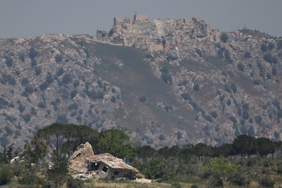 A destroyed house in southern Lebanon, with the Beaufort Castle in the background, near the Israel-Lebanon border, as seen from northern Israel. Reuters