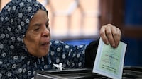 A woman votes during the first round of Egyptian parliamentary elections in November. EPA