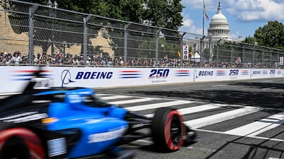 TOPSHOT - US driver #27 Kyle Kirkwood races during the IndyCar Freedom 250 Grand Prix in Washington, DC, on August 23, 2026. The Freedom 250 Grand Prix is part of celebrations marking the 250th anniversary of US independence. The race will cover 147 laps of a 1.7-mile, seven-turn street circuit around the National Mall, passing landmarks including the US Capitol and Washington Monument. (Photo by ROBERTO SCHMIDT / AFP)