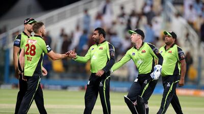 Qalandars celebrate taking the wicket of Tigers batsman Riley Rousseau. Chris Whiteoak / The National