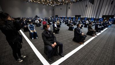 Attendees are socially distanced during the Samsung Electronics Co. annual general meeting at the Suwon Convention Centre in Suwon, South Korea. Bloomberg