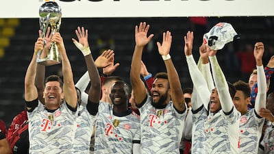 Robert Lewandowski lifts the trophy after Bayern Munich defeated Borussia Dortmund in the German Super Cup at Signal Iduna Park on Tuesday, August 17.