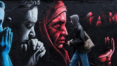 A pedestrian pass by graffiti in honour of the victims of the Paris terrorist attacks made by Kazakhstani artist called 'ChemiS' in Prague, Czech Republic. Filip Singer / EPA