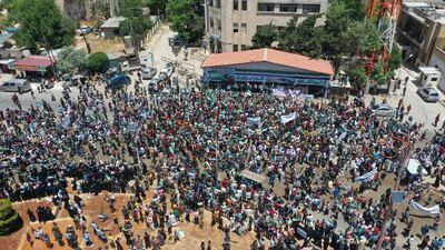 A photo taken with a drone shows an aerial view of a protest against the presidential elections, in Idlib, Syria, 26 May 2021. EPA