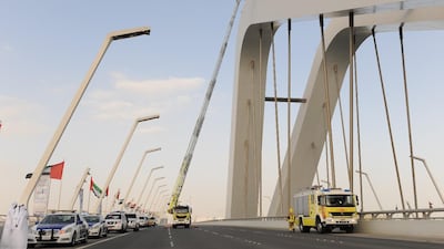 Police talk an Emirati out of jumping off Sheikh Zayed Bridge on Monday. Courtesy Abu Dhabi Police