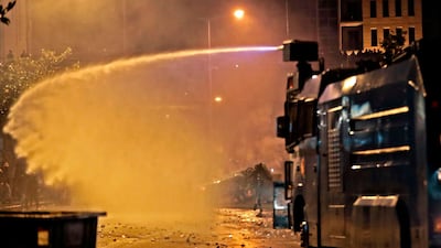 Lebanese security forces use a water canon to disperse supporters of Lebanon's Hezbollah and Amal groups. AFP