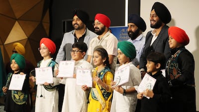 Children received certificates and awards during the anniversary event.