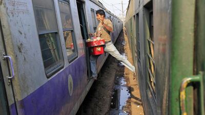 A vendor moves from one train to another at a railway station in Kolkata. Rupak De Chowdhuri / Reuters