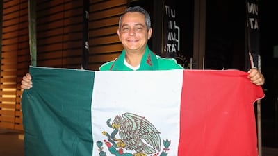A Dubai resident shows his support for co-hosts Mexico. Chris Whiteoak / The National