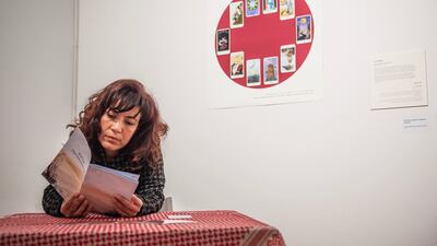 A visitor explores Eman Magdy's Play a Little Game for Me installation