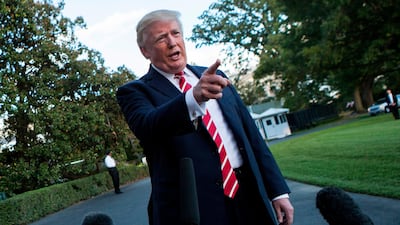 Donald Trump speaks to reporters outside the White House earlier this month. Alex Edelman / AFP