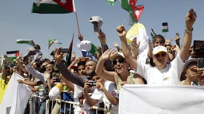 Pope Francis (not pictured) is received by crowds waving the Jordanian and Vatican flags as he arrives to celebrate a mass at Amman International Stadium, Amman, Jordan, 24 May 2014. Amel Pain/EPA