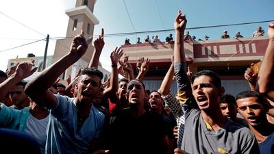 Relatives of Palestinian Nasser Mosabih, 12, who was killed during a protest along the Israel-Gaza border fence, mourn during his funeral in Khan Yunis in the southern Gaza Strip. AFP