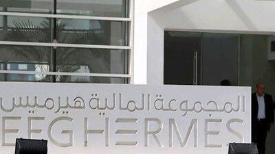 People exit the new headquarters of Egypt-based investment bank EFG-Hermes, on the outskirts of Cairo, October 19, 2010. REUTERS/Asmaa Waguih (EGYPT - Tags: BUSINESS)