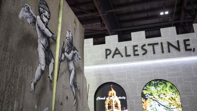 The 'replica separation barrier' created by British street artist Banksy stands. Reuters