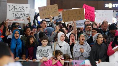 Protesters gather to denounce President Donald Trump’s executive order that bans certain immigration, at Dallas-Fort Worth International Airport in Dallas, Texas. G. Morty Ortega / Getty Images / AFP