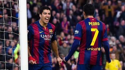 Barcelona's win excites Luis Suarez, left, more than his goal did. David Ramos / Getty Images
