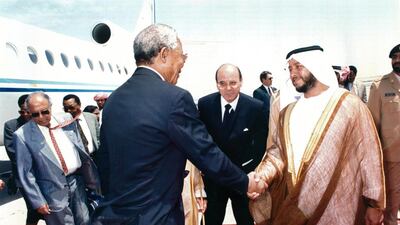 Nelson Mandela is greated by Sheikh Sultan bin Zayed bin Sultan during his visit to the UAE.