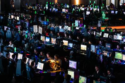 Participants sit at a computer monitor to play a video game at the 2019 DreamHack video gaming festival n Leipzig, Germany. Getty Images