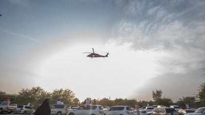 A military helicopter flies overhead. Leslie Pableo for The National
