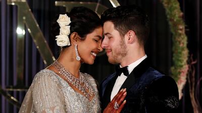 Newlyweds Priyanka Chopra, 36, and Nick Jonas, 26, pose for a photograph during a reception at a hotel in New Delhi on December 4, 2018. Photo: Reuters