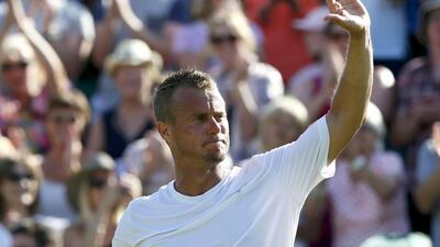 Lleyton Hewitt of Australia gestures to the crowd after losing his match against Jarkko Nieminen of Finland at Wimbledon on June 29, 2015. REUTERS/Stefan Wermuth