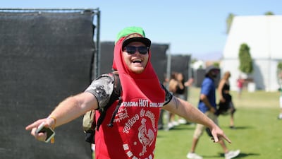 A man dressed as a bottle of sriracha at Coachella Valley Music and Arts festival. Getty