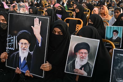 People carry portraits of Iran’s assassinated supreme leader Ayatollah Ali Khamenei in Lahore, Pakistan. AFP
