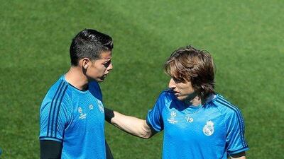 James Rodriguez of Real Madrid (L) talks with Luka Modric of Real Madrid during a training session ahead of the Uefa Champions League semi-final second leg between Real Madrid and Manchester City at Valdebebas training ground on May 3, 2016 in Madrid, Spain. (Photo by Gonzalo Arroyo Moreno/Getty Images)