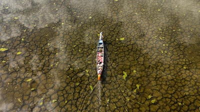 A fishing boat in the Hawizeh Marshes in Maysan province, southern Iraq, after rainfall following a long period of drought. All photos: AFP
