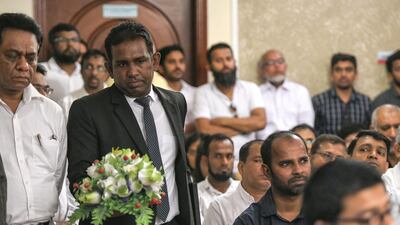 People attend the multi-religious observances at the Sri Lankan Embassy.