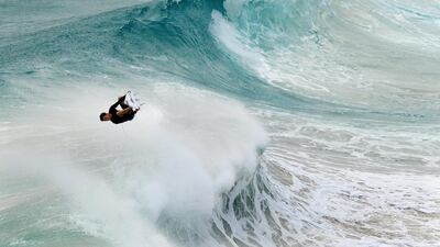 A person surfs a large wave a Flagstaff Beach in northern New South Wales, Australia. EPA