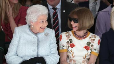 A new definition of the term 'power front row': Britain's Queen Elizabeth II sits next to 'Vogue' Editor-in-Chief Anna Wintour as they view Richard Quinn's runway show before presenting him with the inaugural Queen Elizabeth II Award for British Design. Yui Mok / Reuters