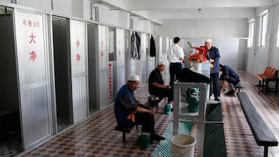 A group of Hui Muslim men perform ablution. Sarah Dea / The National