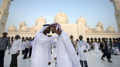 Greetings after Eid Al Fitr prayers at the Sheikh Zayed Grand Mosque in Abu Dhabi last year. Christopher Pike / The National