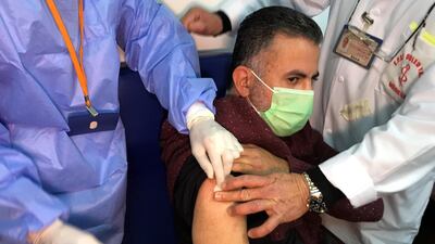 A man receives an injection with Sputnik V vaccine against Covid-19. Reuters