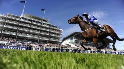 Paul Hanagan riding Taghrooda to victory in the English Oaks at Epsom Racecourse on June 6, 2014, in Epsom, England. Alan Crowhurst / Getty Images