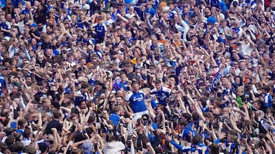 Ipswich Town's Wes Burns, centre, celebrates with fans. PA