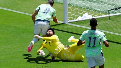 At the San Francisco Bay Area Stadium, Qatar's goalkeeper Mahmoud Abunada fouls Switzerland's Remo Freuler to give away a penalty. Reuters