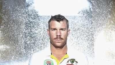 David Warner of Australia poses under falling water on Tuesday in Dubai ahead of Australia's two-Test series against Pakistan starting Wednesday. Ryan Pierse / Getty Images / October 21, 2014