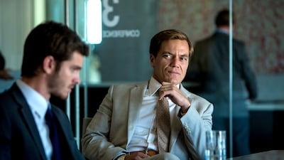 Andrew Garfield portrays Dennis Nash, left, and Michael Shannon portrays Rick Carver in the movie 99 Homes. Hooman Bahrani / Broad Green Pictures via AP