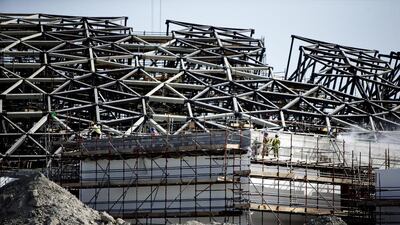 The site, several metres below sea-level, is protected by a temporary dam that will eventually be removed to allow the Arabian Gulf to wash against the museum’s exterior.