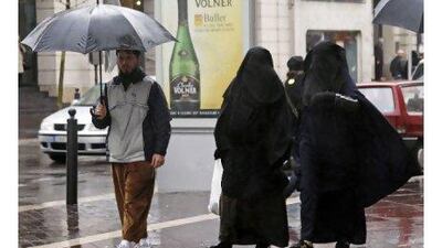 Readers express their opinions about the ban on burqas and niqabs in France. Women such as this pair in Marseilles now face fines of 150 euros. Jean-Paul Pelissier / Reuters